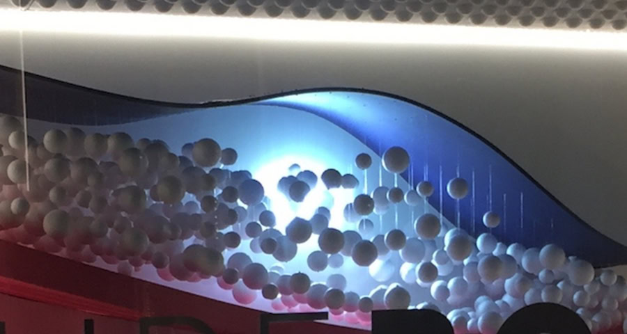 A display of balloons on a wall.