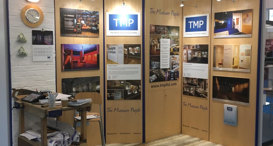 A wooden display with pictures on it.